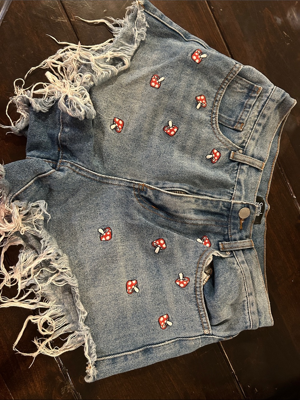 Simple Society. High-Rise Blue Denim Shorts with Red Mushroom Embroidery